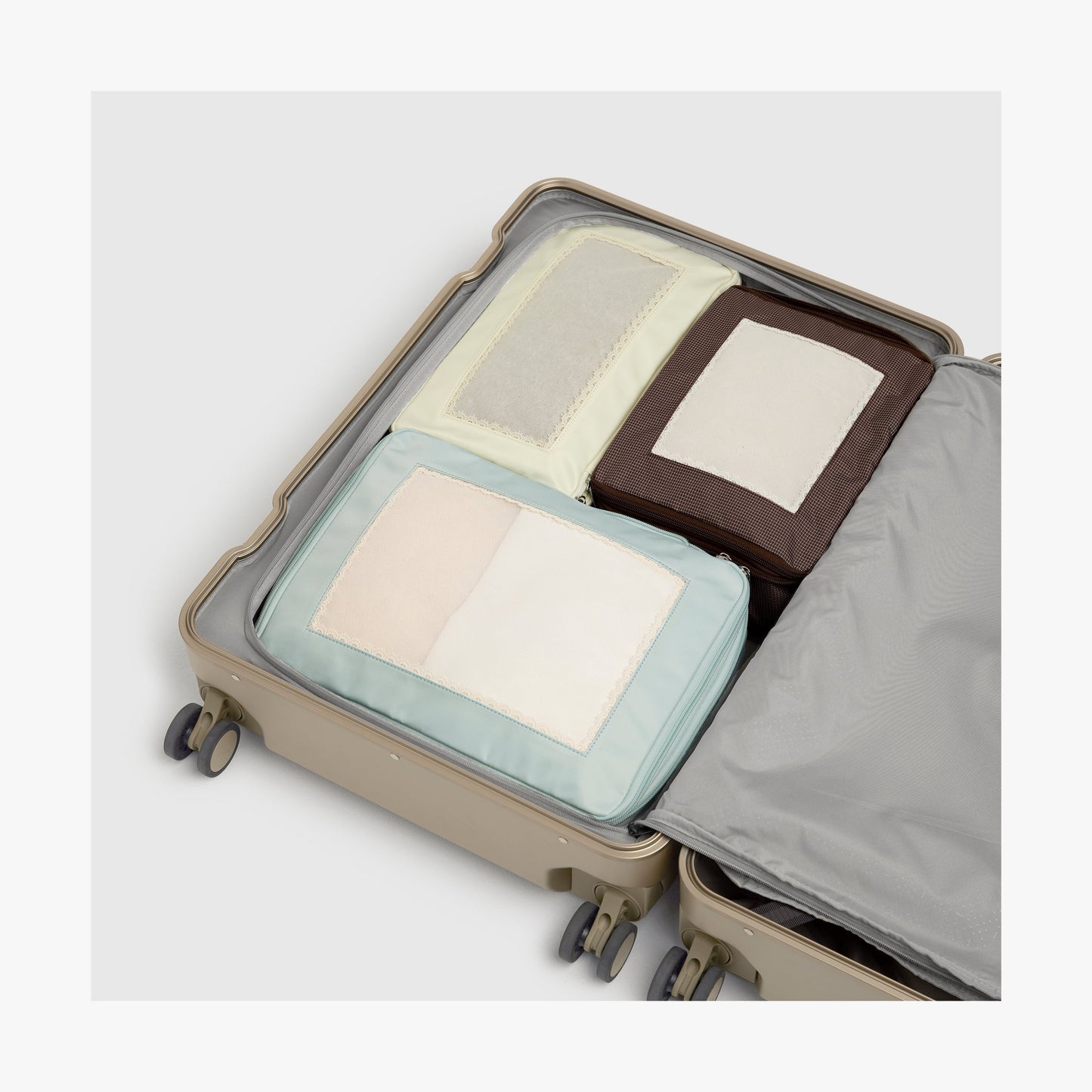 Monos × Reformation Compressible Packing Cubes